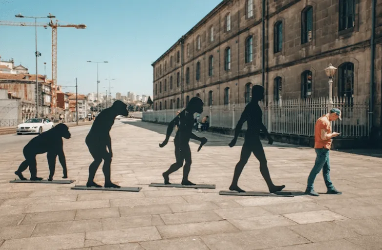 On an empty street a monkey evolves into a man.